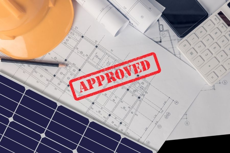 Architectural drawings with solar panel and 'approved' stamp
